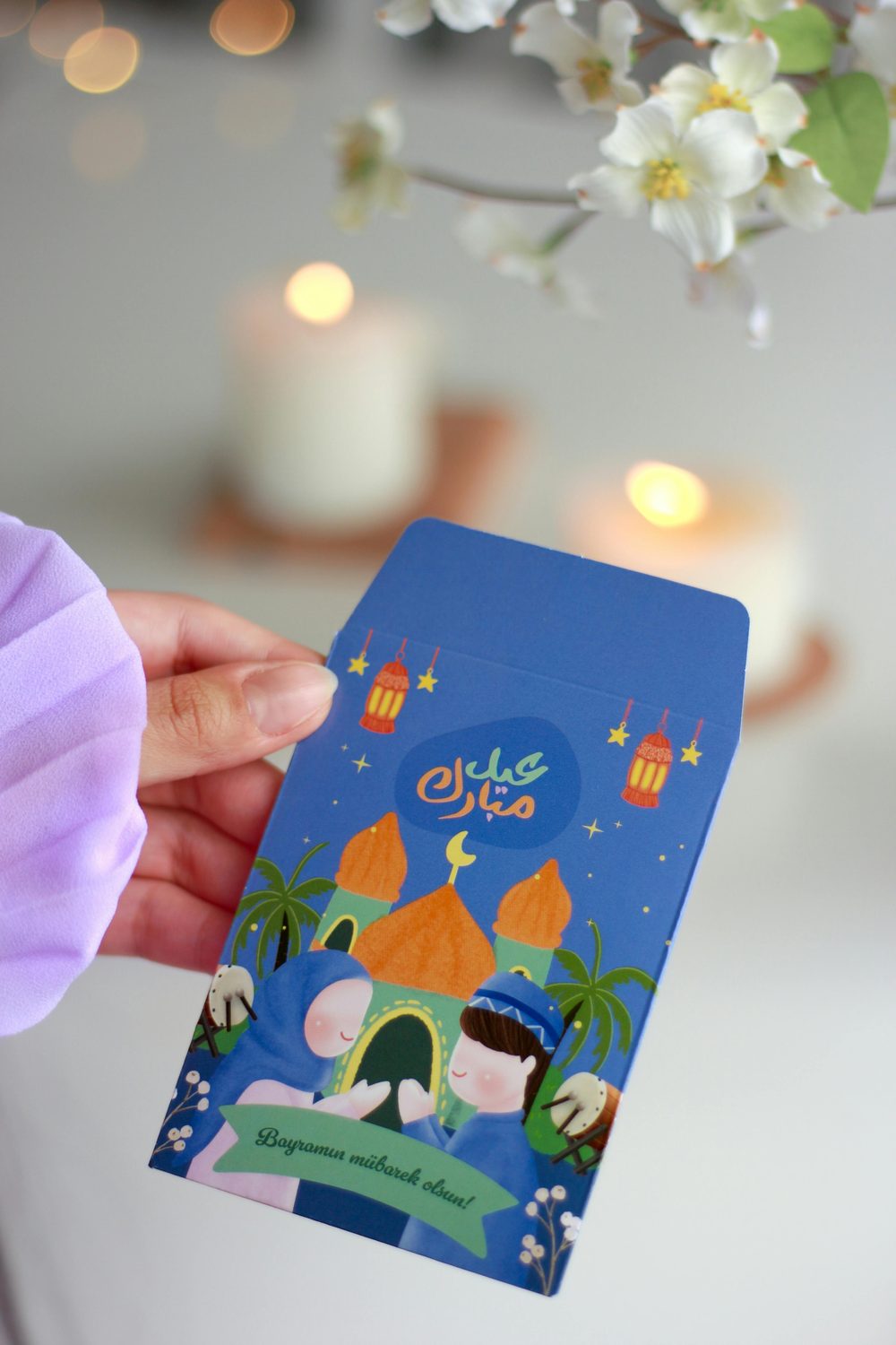 Illustrated Eid Mubarak greeting card with mosque, lanterns and stars — ideal for adding a personal QR code greeting